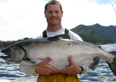 King Salmon fishing on Prince of Wales Island. Adventure Alaska Southeast fishing charters. Man holding giant King Salmon